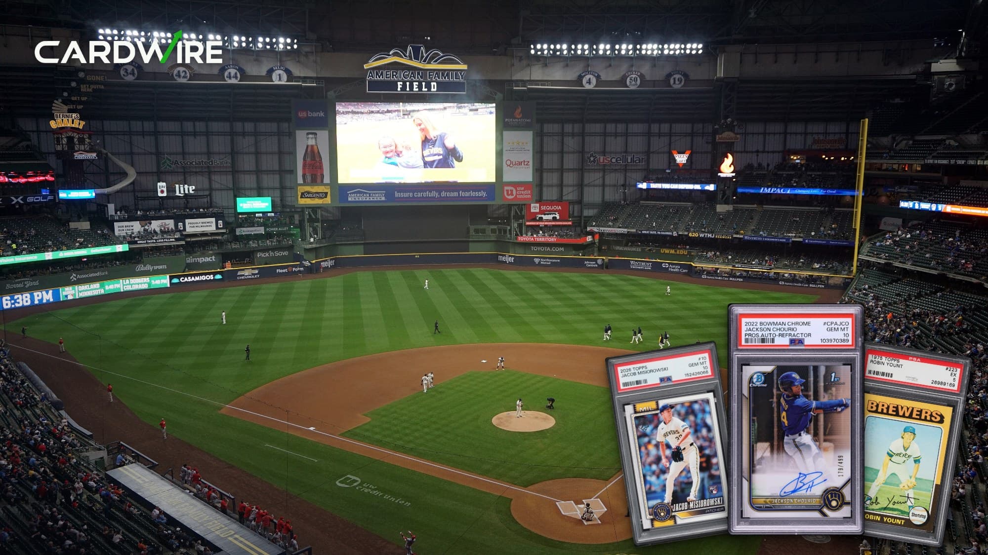 American Family Field from behind home plate during a Brewers game, with Jacob Misiorowski's 2026 Topps rookie, Jackson Chourio's 2022 Bowman Chrome autograph and Robin Yount's 1975 Topps rookie in front